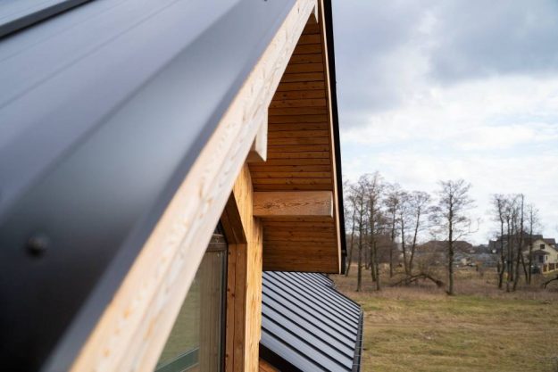 Image of a newly installed roof with fresh shingles, demonstrating the outcome of a roof replacement.